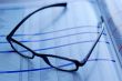 glasses on newspaper page