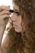 red haired female teenager with mascara