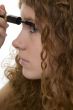 red haired female teenager with mascara