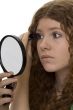 red haired female teenager with mascara