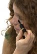 red haired female teenager with mascara