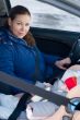 Mother and child in car safety seat