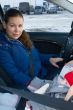 Mother and child in car safety seat