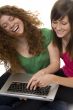 Two teenagers with laptop computer