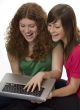 Two teenagers with laptop computer