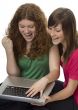 Two teenagers with laptop computer