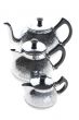 Three metal teapot on white