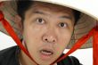 Surprised asian man wearing hat