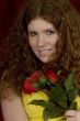 red haired teenager with red roses
