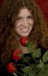 red haired teenager with red roses