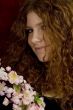 red haired teenager with cherry blossoms