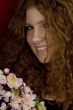 red haired teenager with cherry blossoms