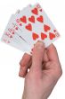 Playing card with heart on hand