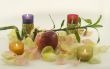Bamboo and big red fresh apple with aromatic rose leave in rays