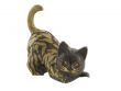 Bronze statuette of fun cat isolated over white