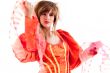 Cute teenage girl presenting her orange fancy dress