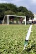 Soccer players at the field, syringe in foreground