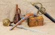 Bottle, rapier, sword, pistol and chest