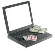 Laptop with playing card and money