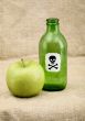Green bottle and green apple