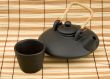 Black ceramic chinese teapot and mugs