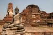 Sitting Buddha in ancient ruins