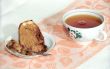 Tea cake with nuts and cup of tea