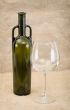 Glass of wine and green bottle