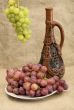 Ceramic bottle and grapes