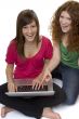 Two teenagers with laptop computer