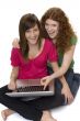Two teenagers with laptop computer