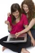 Two teenagers with laptop computer