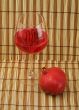 Glass of wine and red pomegranate