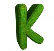 3d letter K in green grass