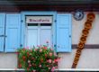 Cookies shop facade with cake tins