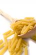  macaroni in wooden spoon