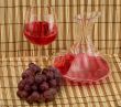 Stil life with decanter, goblet and grape