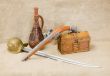 Bottle, rapier, sword, pistol and chest