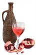 Glass of wine, bottle and a red pomegranate