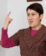 Short-haired woman raising her finger