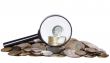 Coins and magnifier