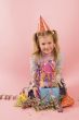 little girl in front of her present on her birtday