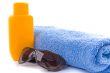 towel, sunglasses and lotion
