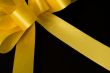 Yellow ribbon on black backgroung