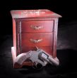 A small box and revolver