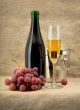 Champagine bottle, grape and goblet on canvas background