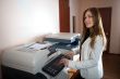 Young business woman at photocopier
