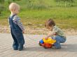 Children with a toy truck
