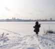 girl at thebank of frozen river