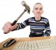 Young man with hammer on hand and keyboard